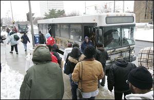 Passengers at the Seagate Station downtown change buses on the TARTA system, which experienced an increase in riders last year.