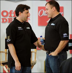 Tony Stewart, left, talks with Ryan Newman during the NASCAR media tour yesterday in Concord, N.C. Newman will be driving one of Stewart s cars for his Stewart-Haas Racing team.