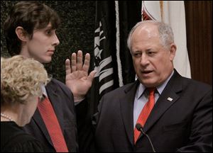 Democratic Lt. Gov. Patrick Quinn was promptly sworn in as governor and said he would work to 