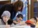 Alexa Brown, left, of Clyde, Ohio, participates in an art class at Green Springs School. The 10-year-old was diagnosed with a brain tumor in 2006. The tumor was removed, but cancer reappeared in her spine in May.