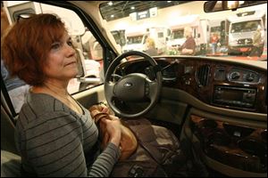 Sue Goldsmith, sitting in a Ford Cambria   one of about 100 RVs on display   tells her husband she could drive it.