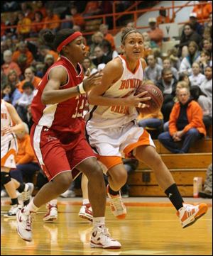 Bowling Green's Niki McCoy drives to the hoop against Hartford in December. The Falcons junior is expected to return from her team suspension on Feb. 21 at Akron.