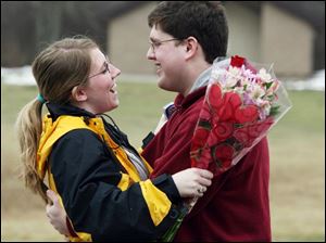 Slug: ROV valentine10p                  The Blade/Jeremy Wadsworth  Date: 02/10/09  Caption: Colton Barhizer of Sylvania surprises his girlfriend Brandi Phillips with a bouquet of flowers in observance of an early Valentines Day Tuesday, 02/10/09, at Wildwood Metro Preserve in Toledo, Ohio.