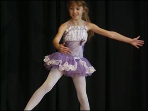 Third-grader Ashley Grego dances in the talent show.
