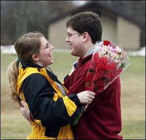 Slug: ROV valentine10p                  The Blade/Jeremy Wadsworth  Date: 02/10/09  Caption: Colton Barhizer of Sylvania surprises his girlfriend Brandi Phillips with a bouquet of flowers in observance of an early Valentines Day Tuesday, 02/10/09, at Wildwood Metro Preserve in Toledo, Ohio.