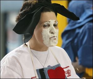 Teacher Ruth Boyles has a face full of cream after a pie-eating contest. 