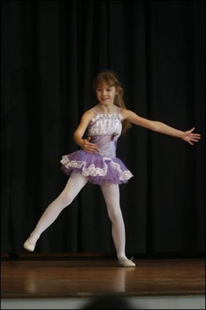 Third-grader Ashley Grego dances in the talent show.