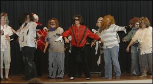 Teachers perform  Thriller,  with inclusion aide Heidi Linsenmeyer as Michael Jackson, in the finale of the Custer Elementary School talent show.  