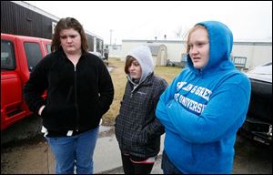 Morgan Carpenter, 16, MaKayla Ackerman, 13, and Breanna Perry, 16, discuss Jacob Polen and David Todd, who were killed in a single-car crash on Tuesday night. The two were passengers in a car driven by Glenn Walbolt, 56, who survived.