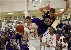Waite s David Butte goes flying through the air trying to stop Central s Drew Lehman (10) last night at the Sullivan Center.
