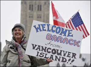 Jackie Ward of Denman Island, B.C., awaits President Obama s arrival in Ottawa to meet with Prime Minister Stephen Harper. Thousands eagerly awaited the President s arrival.