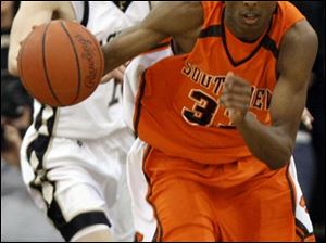 Southview s Shaun Joplin heads up court after stealing the ball from Perrysburg s Jake Smith. Joplin scored 17 points.