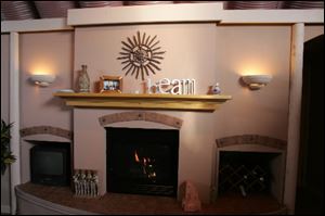 The room's Southwest theme is carried through in the mantel decorations.