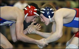 Jacob Martin of St. Francis, left, and Springfield's Garrett Manley square off for a sectional title at 112 pounds Saturday night at Start. Martin won 2-0, his second victory over Manley.