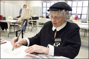Norma Veit works on a watercolor at the Sylvania Senior Center.