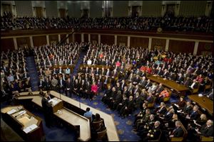 During a joint session of Congress, President Obama said the economic crisis is an opportunity for Americans to raise their ambitions. He spoke about energy, health care, and education programs.
<br>
<img src=http://www.toledoblade.com/graphics/icons/video.gif><b><font color=red> AP VIDEO</b></font color=red>: <a href=