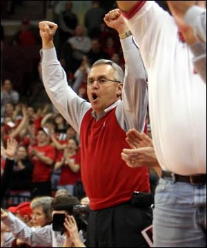 Ohio State football coach Jim Tressel cheers for the Buckeyes during the second half Tuesday night in Columbus. Ohio State defeated Penn State 73-59.