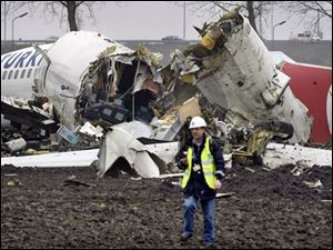 A Boeing 737-800 with 134 people aboard slammed into a muddy field and broke apart about two miles from Amsterdam's Schiphol Airport. The jetliner's flight data recorders were recovered.