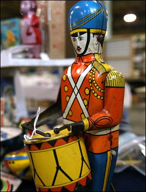 A pressed tin J. Chein Drummer Boy Wind Up Toy from the 1930s is for sale at the show.