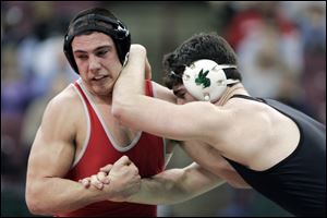 Central Catholic's Dave Pickerel, left, battles Medina Highland's Tyler Houska in the 215-pound final. Pickerel fell in overtime. 
<br>
<img src=http://www.toledoblade.com/graphics/icons/photo.gif> <font color=red><b></b></font><a href=
