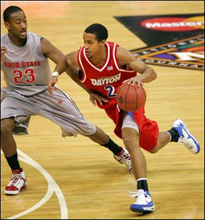 Dayton's Brian Roberts drives past Ohio State's David Lighty last year. Roberts, a St. John's Jesuit graduate, is UD's all-time 3-point shooter.