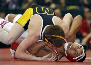 Patrick Henry's Alex Lopez finds himself on his back during his 125-pound bout against Monroeville's Logan Stieber, who won 16-1 to stretch his winning streak to 125 matches.
