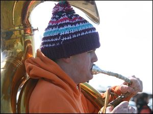 Sousaphone player Jacob Varble, a senior, concentrates on his work as he joins fellow band members at practice.