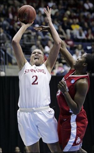 Stanford forward Jayne Appel, goes up for a shot as Ohio State center Jantel Lavender attempts to block in the second half during a women's NCAA tournament regional championship college basketball game in Berkeley, Calif., Saturday, March 28, 2009. 