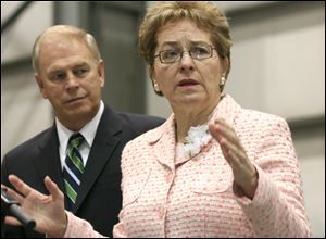 Accompanied by Gov. Ted Strickland, U.S. Rep. Marcy Kaptur talks about the allocated funds. They joined other officials at Toledo Shipyard, which is to receive funds for repair and other work.