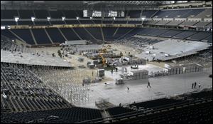 Crews prepare Ford Field for the NCAA Final Four Saturday and Monday. The NCAA expects a record attendance for the event.