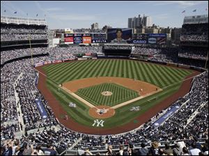 C.C. Sabathia throws the first pitch at Yankee Stadium.