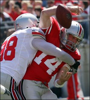 Quarterback Joe Bauserman is sacked by Solomon Thomas in Saturday's Ohio State spring game. The Gray team won 23-3.