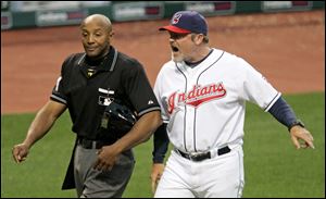 Indians manager Eric Wedge argues with home plate umpire C.B. Bucknor after being ejected in the fourth inning Monday night.