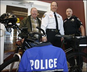 From left: Councilman Darryl Bittner, police Chief Randy Hill, and Sgt. Todd Mocniak display the gear to be used by the patrol.