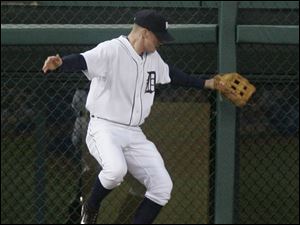 Detroit outfielder Josh Anderson can t come up with a fly ball off the bat of New York s Hideki Matsui in the fourth inning.
