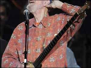 Pete Seeger performs at the benefit concert celebrating his 90th birthday at Madison Square Garden on Sunday. The concert is a benefit for Hudson River Sloop Clearwater, created by Seeger to preserve and protect the Hudson River.