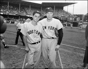 Dom DiMaggio of the Boston Red Sox, left, and his brother Joe DiMaggio of the New York Yankees on July 12, 1949.
