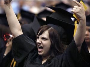 Slug: CTY OWENSGRAD08P A         The Blade/Jeremy Wadsworth  Date: 05/08/09  Caption: Jessica Utell celebrates graduating with an Associate degree of Applied Science (massage therapy) Friday, 05/08/09, at Owens Community College.