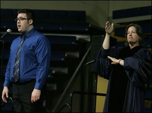 CTY utgrad10p  Bowsher High School graduate and Universityof Toledo music major Sam Mason, left, sings the Star-Spangled Banner and Terri (cq) Stibaner inteprets it.  Graduation ceremonies are held at the University of Toledo in Toledo, Ohio on May, 10, 2009. There are 2,944 candidates for degrees from the colleges of Arts and Sciences, Business Administration, Education, Engineering, Health Science and Human Service, Law, Medicine, Nursing, Pharmacy and University College.   The Blade/Jetta Fraser