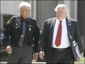 Lucas County Sheriff James Telb walks with his lawyer, Richard Kerger, before being arraigned.