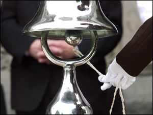As the roll of fallen Wood County lawmen is read in Bowling Green, a ceremonial bell tolls for each name on the roster.