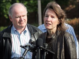 Susan LeFevre, with her husband, Alan Walsh, speaks with reporters after her release from the Huron Valley prison.