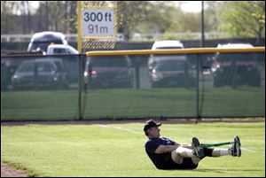 Jim Burnor stretches before his game; he is a self-employed real-estate appraiser.