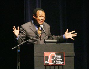 Clarence Page's quick asides keep the audience at the Stranahan Theater laughing.