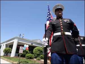 Lance Cpl. Richard Cable and other members of the Marine Corps stand in front of the Vet Center, 1565 S. Byrne Rd., Ste. 104, Toledo. The center, which opened in August, had an open house yesterday. It offers readjustment counseling and outreach services to any veteran who served in any combat zone. It also offers help to family members.