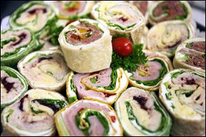 Cold cuts are displacing hot meals at some local catering firms.
