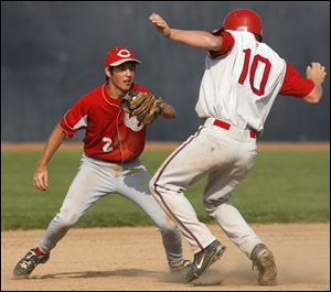 Central's Troy Toland tags out Luke Goblirsch of St. Francis in their semifinal match-up.