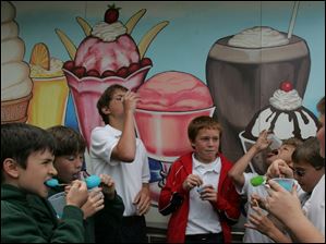 ROV reward  05/26/2009     The Blade/Lori King  OLPH 6th graders from left: Zach Stearns, Zachary Roller, Matt Cark, Chase Petrie, Jordan Rodriguez, Isaac Kookoothe and Ben Dubielak (all names cq'd) enjoy cold treats at Lickity Split in Toledo, OH. The boys were rewarded ice cream treats from their gym teacher, Amy Ashner, for earning a perfect score of 10 points throughout the year for "following procedures, like good sportsmanship and positive attitudes."