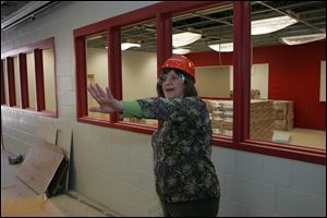 Library media specialist Patti Rish looks around what will be the media center.