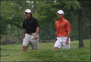 Oklahoma State's Ricky Fowler, left, and Florida's Billy Horschel walk to the green on No. 14 at
Inverness yesterday. Horschel's 76 was the team's top score as the No. 3 Gators struggled.